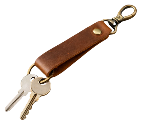 Keep your keys organized in style with the Loop genuine leather keychain. Made from high-quality Crazy Horse solid leather construction is reinforced with a secure metal button joint, ensuring strength you can rely on every day. Over time, the leather develops a beautiful patina, making each piece truly one of a kind. Now available at our Smyrna, TN shop not far from Franklin.

Dimensions: 6 × 0.85 inches