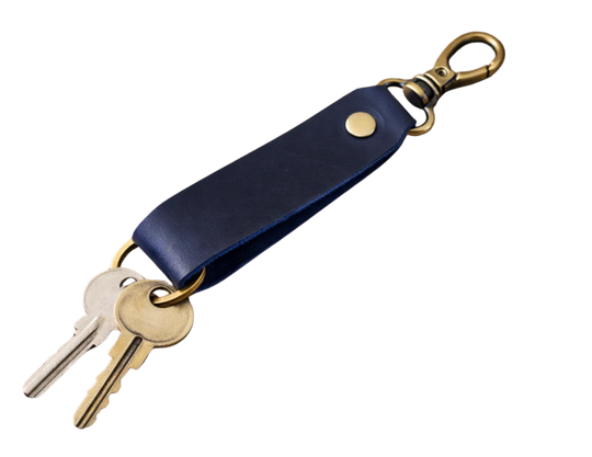 Keep your keys organized in style with the Loop genuine leather keychain. Made from high-quality Crazy Horse solid leather construction is reinforced with a secure metal button joint, ensuring strength you can rely on every day. Over time, the leather develops a beautiful patina, making each piece truly one of a kind. Now available at our Smyrna, TN shop not far from Franklin.

Dimensions: 6 × 0.85 inches