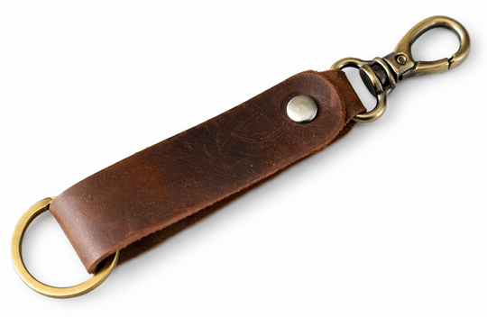 Keep your keys organized in style with the Loop genuine leather keychain. Made from high-quality Crazy Horse solid leather construction is reinforced with a secure metal button joint, ensuring strength you can rely on every day. Over time, the leather develops a beautiful patina, making each piece truly one of a kind. Now available at our Smyrna, TN shop not far from Franklin.

Dimensions: 6 × 0.85 inches