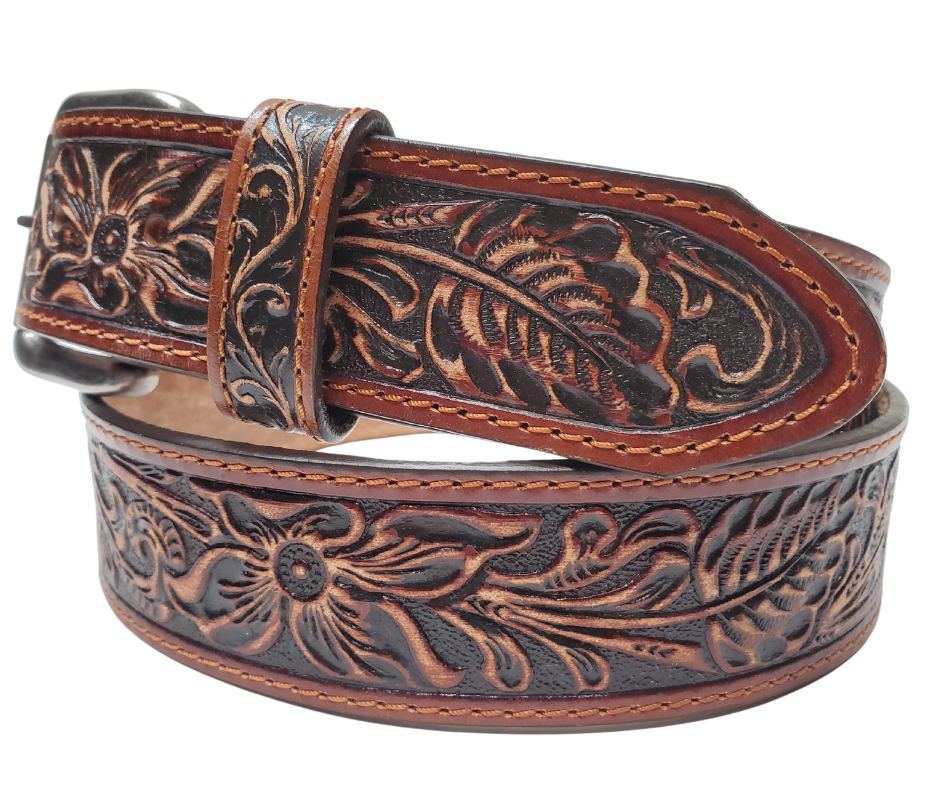 Experience the essence of the Old West with this 1 1/2" leather belt, featuring Edge stitching and a classic Western pattern. Its slightly distressed deep mahogany brown leather adds a touch of rustic charm to any outfit. Visit our Smyrna, TN shop, just a quick rideshare away from the bustling Wild West vibe of downtown Nashville.
