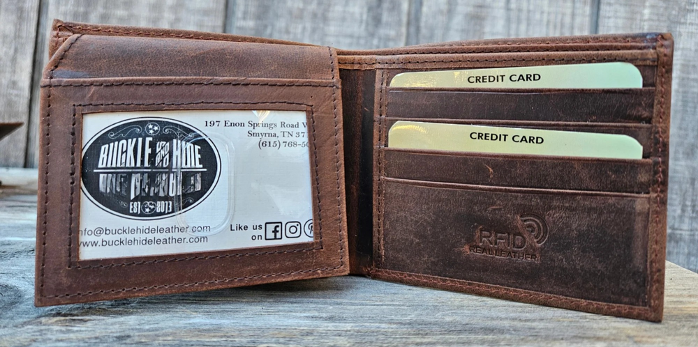 With a name like Lincoln this has to be a practical Bi-fold leather wallet. Equipped with 10 credit card slots and 2 ID window slots on a flip-up extension piece. The main compartments has a cash divider. Lined with RFID blocking. . Available in our Smyrna, TN shop near Sewarts Landing.

Made in India.