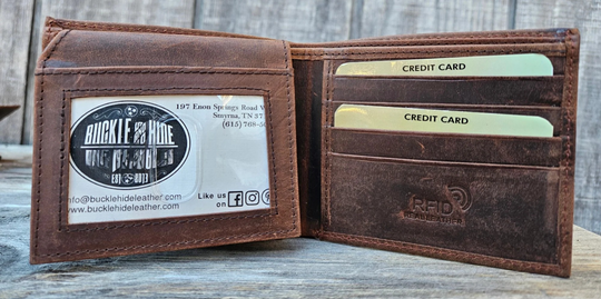 With a name like Lincoln this has to be a practical Bi-fold leather wallet. Equipped with 10 credit card slots and 2 ID window slots on a flip-up extension piece. The main compartments has a cash divider. Lined with RFID blocking. . Available in our Smyrna, TN shop near Sewarts Landing.

Made in India.