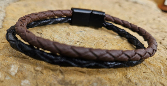 Plait is the word for 5 or more strips for a braid. The Cord of 2 is Leather meticulously handcrafted in Turkey. Designed for Comfort these bracelets offer a comfortable wear experience for any wrist size. Whether worn solo or layered with other accessories, they add a touch of rugged elegance to your attire. New to our Smyrna, TN shop come by and see them.

Fit&