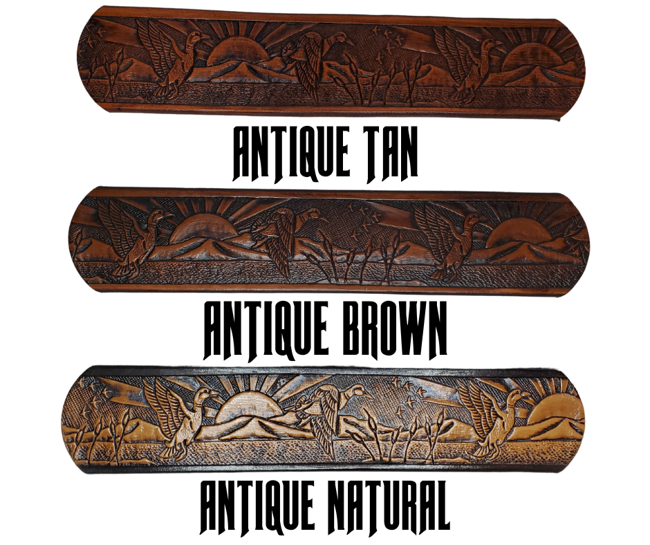 This solid strip of Veg Tan cowhide, is hand stained in 4 brown options, with smooth, finished edges. Embossed with a Mallard Duck scene down length of belt, or have name added to scene up to 8 letters. Belt thickness is approx. 1/8", and 1 1/2" wide. Sizes available are 34" to 44" from buckle end to hole most worn. Attached with 2 snaps is a Brushed Nickel plated solid brass buckle. 