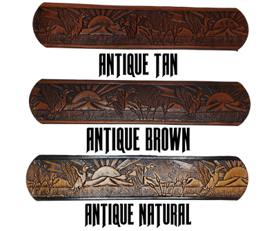 This solid strip of Veg Tan cowhide, is hand stained in 4 brown options, with smooth, finished edges. Embossed with a Mallard Duck scene down length of belt, or have name added to scene up to 8 letters. Belt thickness is approx. 1/8", and 1 1/2" wide. Sizes available are 34" to 44" from buckle end to hole most worn. Attached with 2 snaps is a Brushed Nickel plated solid brass buckle. 
