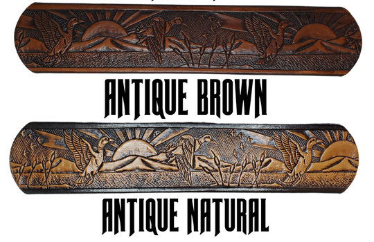 This solid strip of Veg Tan cowhide, is hand stained in 4 brown options, with smooth, finished edges. Embossed with a Mallard Duck scene down length of belt, or have name added to scene up to 8 letters. Belt thickness is approx. 1/8", and 1 1/2" wide. Sizes available are 34" to 44" from buckle end to hole most worn. Attached with 2 snaps is a Brushed Nickel plated solid brass buckle. 