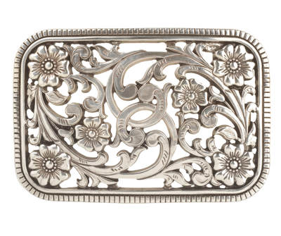 Get the perfect blend of Western and non-Western style with this Antique Silver buckle featuring a Filigreed Vine and Flower scroll design. The rectangular shape with rounded edges and rope design border adds a unique touch to any outfit. It's 3" tall by 4" wide, fitting belts up to 1 1/2" wide. Find it at our retail shop in Smyrna, TN or conveniently purchase it online. Imported