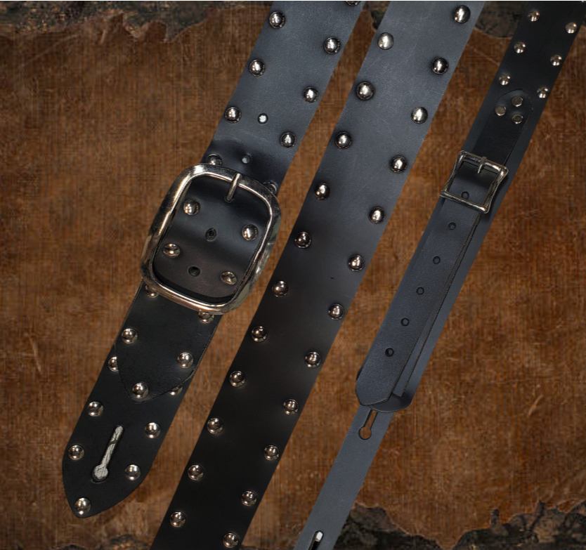 Studs and Eyelets like Marshalls have have been staple for years in Rock music!  "This 2" wide Guitar Strap is a nod to that classic influence. It's made from Pebbled Veg-Tan Cowhide and after some gig's it'll look like you bought in a Vintage shop. The classic adjustment style goes from approx. 42" to 56" at it's longest . Made just outside Nashville in our Smyrna, TN. shop. It will need a bit of time to "break in" but will get a great patina over time.  