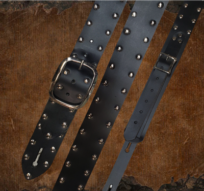 Studs and Eyelets like Marshalls have have been staple for years in Rock music!  "This 2" wide Guitar Strap is a nod to that classic influence. It's made from Pebbled Veg-Tan Cowhide and after some gig's it'll look like you bought in a Vintage shop. The classic adjustment style goes from approx. 42" to 56" at it's longest . Made just outside Nashville in our Smyrna, TN. shop. It will need a bit of time to "break in" but will get a great patina over time.  