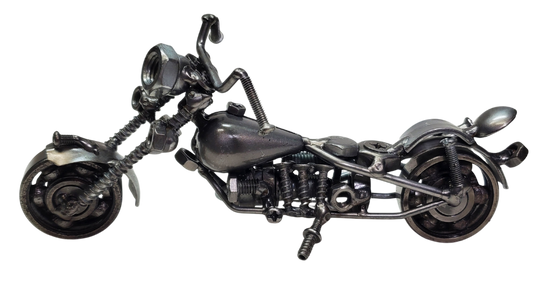 Each piece is hand-crafted using sprockets, chains, nuts, bolts, washers, springs, and bearing wheels, making it a truly one-of-a-kind present. For exact measurements, check out the photo. You can find these METAL artwork pieces at our Smyrna store, located just minutes from Nashville, TN.

Size Approx. 4" tall x 7 1/2" long x 3 wide
Imported