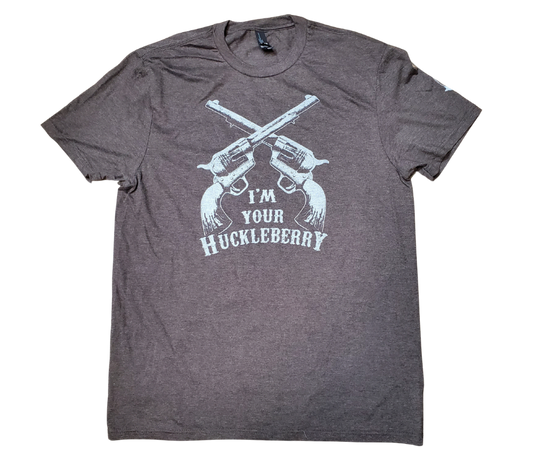 The I'm your Huckleberry line has become one of the most known in Westerns at this point. Get your's in Chocolate Brown with the famous graphic. Available online and in our retail shop in Smyrna, TN. Made of super soft 50% ring spun cotton &amp; 50% poly. Pre-shrunk.