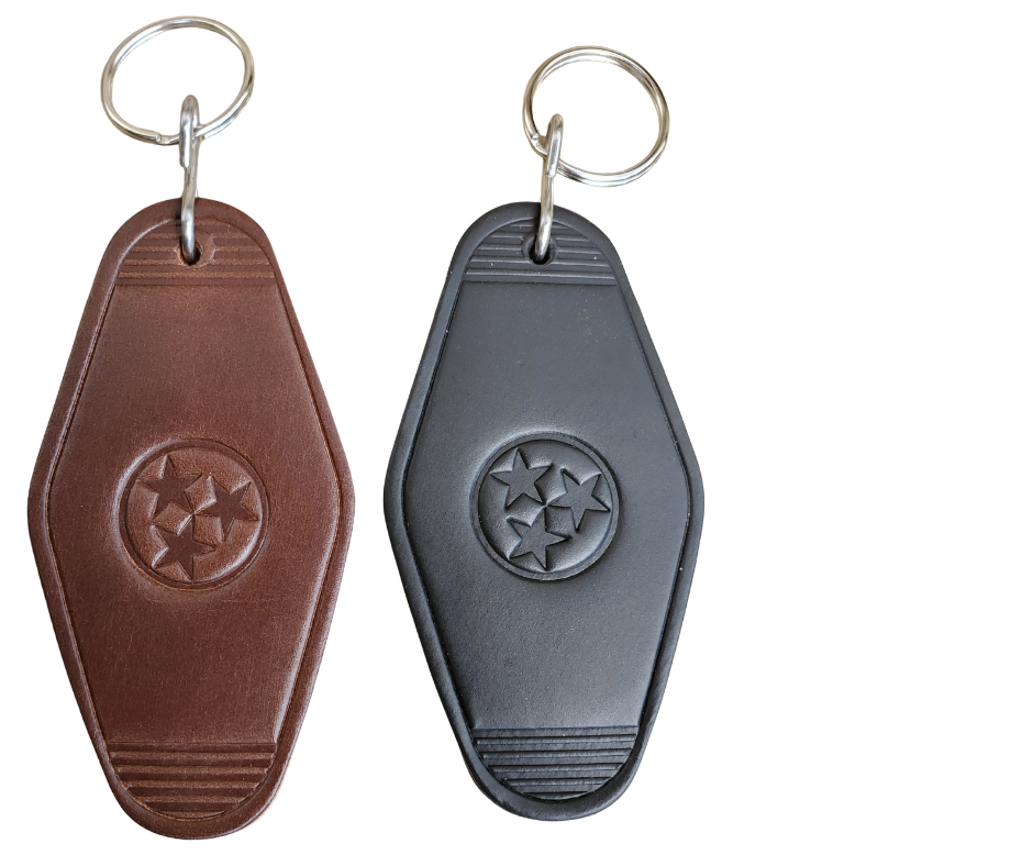 Motel shaped key fob. Choose either black or brown. Tristar logo is embossed in center.