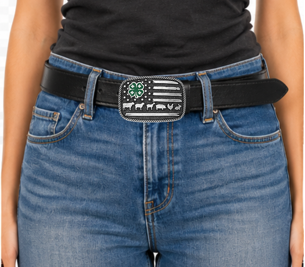 The 4-H Livestock Buckle features a silver toned, square shape with a twisted rope edge. An American flag background displays a green painted 4-H clover among the stars, and finishes with one of the stripes as a line of livestock. Fits 1 1/2" belts and is approx. 3" tall x 4"across. Available at&amp;nbsp;our shop just outside Nashville in Smyrna, TN. Made by Montana Silversmith.

Silver over a white metal alloy. Paint. Montana Armor to prevent tarnish.