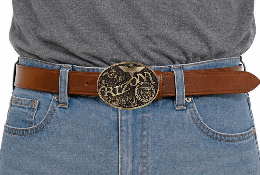 Celebrate Arizona State with this buckle highlighting the life and exploration of man, including a magnificent Thunderbird and the great state seal! Brass plate over a solid cast metal alloy is antiqued and buffed to highlight the details.

Fits 1 1/2" belts and is approx. 3" tall x 4" across. Available at our shop just outside Nashville in Smyrna, TN. Made by Montana Silversmiths.