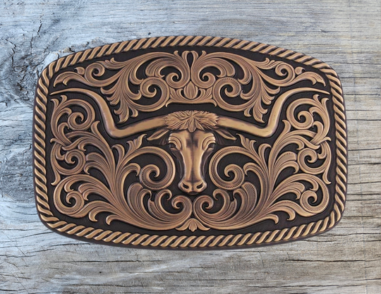 Texas Longhorn steer with a notched horn design. Accompanying the center longhorn figure is stunning flowing filigree and a twisted rope edge. The Vintage Bronze Texas Longhorn Buckle is hand polished for a unique look and celebrates the Texas spirit and pride. It&