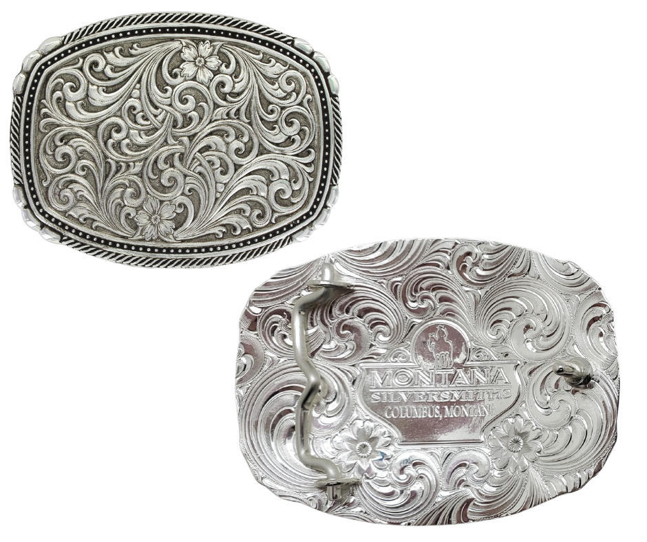 This buckle features a beautiful Intricate Classic Western Scroll pattern as the main design. Its antiqued curved rectangular shape is accented with twisted silver finished rope edging and high-domed beads, framing the bright cut Western scroll design. It can fit a standard 1.5 inch belt and measures approximately 3 3/4"" across x 3" tall. You can find it at our Smyrna, TN location, just a short drive from downtown Nashville. Made by Montana Silversmith.