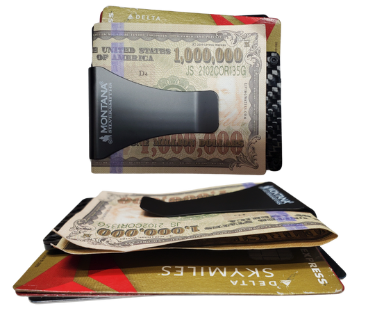 Available at our shop just outside Nashville in Smyrna, TN. Our All American Bronze Credit Card Holder is a beaut! It offers a distinctive, slim design that is practical and comfortable in your hand and pocket, making it an everyday essential. One side with a bronze finished panel of Montana Silversmiths signature bright-cut engraving. The Carbon Fiber side has a clip that can hold your cash. Holder expands to hold a multitude of cards with thick elastic bands.