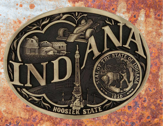 Large lettering spelling out Indiana stretches boldly across, surrounded by a set of antiqued figures in celebration of Indiana heritage including farming, racing, and the state seal. Our cast belt buckles are acid washed to add the dark antiqued patina and hand buffed to bring out the highlights and details. Standard 1.5 inch belt swivel.
Get yours at our local Smyrna ,TN shop.