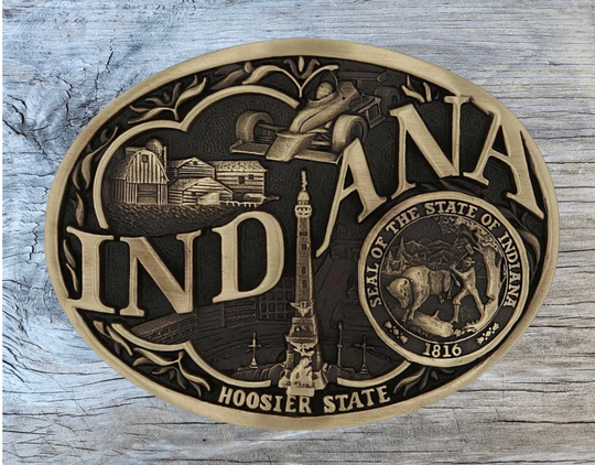 Large lettering spelling out Indiana stretches boldly across, surrounded by a set of antiqued figures in celebration of Indiana heritage including farming, racing, and the state seal. Our cast belt buckles are acid washed to add the dark antiqued patina and hand buffed to bring out the highlights and details. Standard 1.5 inch belt swivel.
Get yours at our local Smyrna ,TN shop.