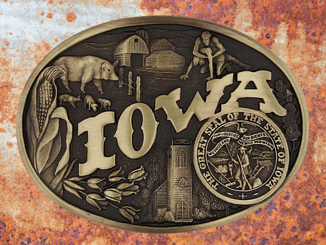 Celebrate Iowa State with this buckle highlighting corn, farming, wrestling, and a church motifs, including the great state seal! Brass plate over a solid cast metal alloy is antiqued and buffed to highlight the details.

Fits 1 1/2" belts and is approx. 3" tall x 4" across. Available at our shop just outside Nashville in Smyrna, TN. Made by Montana Silversmiths.