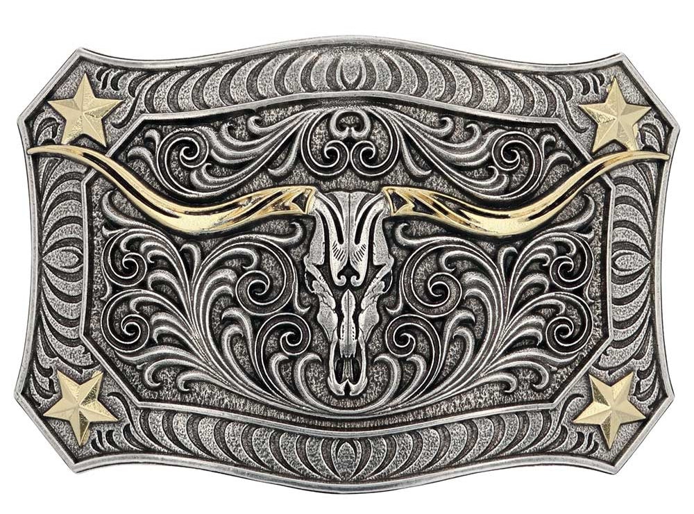 The Longhorn Crest Filigree Belt Buckle is free-spirited and has a western ruggedness. It holds a longhorn skull in the center that is cradled by exaggerated filigree. A mix of silver and gold tones give added depth and character. Each corner has a star and additional filigree while the buckle is framed in a smooth wire-like trim. Fits 1 1/2" belts and is approx. 3" tall x 4"across. Available at our shop just outside Nashville in Smyrna, TN. Made by Montana Silversmith.
