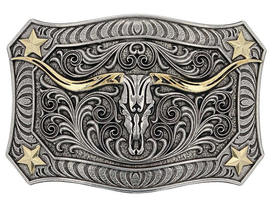 The Longhorn Crest Filigree Belt Buckle is free-spirited and has a western ruggedness. It holds a longhorn skull in the center that is cradled by exaggerated filigree. A mix of silver and gold tones give added depth and character. Each corner has a star and additional filigree while the buckle is framed in a smooth wire-like trim. Fits 1 1/2" belts and is approx. 3" tall x 4"across. Available at our shop just outside Nashville in Smyrna, TN. Made by Montana Silversmith.