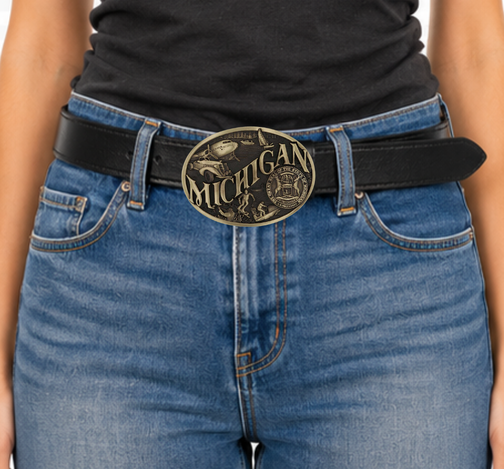 Celebrate Michigan State with this buckle highlighting modes of transportation, hunting, skiing and the state seal! Brass plate over a solid cast metal alloy is antiqued and buffed to highlight the details.

Fits 1 1/2" belts and is approx. 3" tall x 4" across. Available at our shop just outside Nashville in Smyrna, TN. Made by Montana Silversmiths.