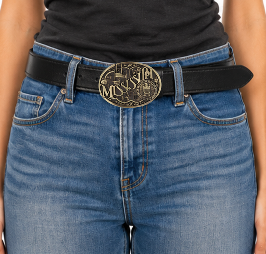 Celebrate Mississippi State with this buckle highlighting the Magnolia State heritage including steamboats and the great state seal. Brass plate over a solid cast metal alloy is antiqued and buffed to highlight the details.

Fits 1 1/2" belts and is approx. 3" tall x 4" across. Available at our shop just outside Nashville in Smyrna, TN. Made by Montana Silversmiths.