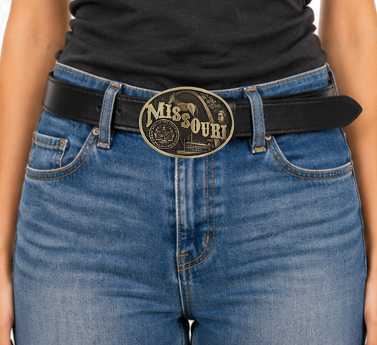 Celebrate Missouri State with this buckle highlighting the St. Louis Arch, Missouri River Steamboats, the Missouri Mule, Albert Einstein for his influence, and the great state seal! Brass plate over a solid cast metal alloy is antiqued and buffed to highlight the details.

Fits 1 1/2" belts and is approx. 3" tall x 4" across. Available at our shop just outside Nashville in Smyrna, TN. Made by Montana Silversmiths.