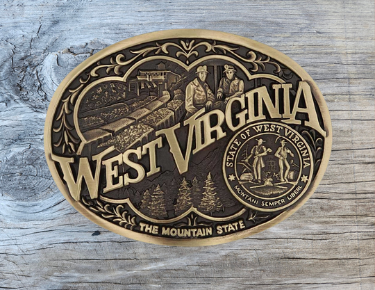 Show your West Virginia Mountain State pride by displaying this buckle highlighting mining and forestry motifs including the state seal!

Fits 1 1/2" belts and is approx. 3" tall x 4" across.&amp;nbsp;Available at our shop just outside Nashville in Smyrna, TN. Made by Montana Silversmiths.