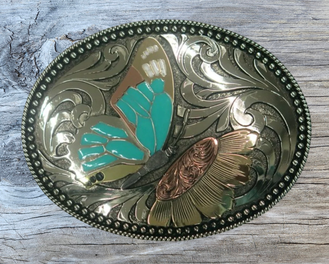 The Monarch belt buckle is made from German Silver(nickel and brass alloy)or iron metal base. These buckles have motifs made of copper, iron or brass and some are adorned with synthetic stones. In order to give you the quality and long lasting final product. Available at our Smyrna, TN shop just outside of Nashville.
