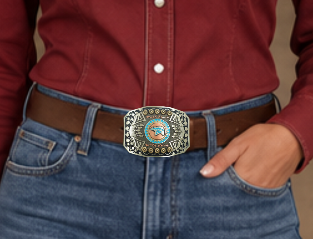 The Mukwa in Ojibwa means bear and strength. This buckle is handmade from German Silver (nickel and brass alloy) or iron metal base. Our products are all handcrafted. In order to give you the quality and long lasting final product we also plate each piece with copper, nickel and silver.&nbsp; to ensure the piece's long lasting qualities. Available at our Smyrna, TN shop just outside of Nashville. Made in Mexico by talented metal workers.
Approx. Width 4” Height 3”/ Standard Swivel fits 1.5” belts