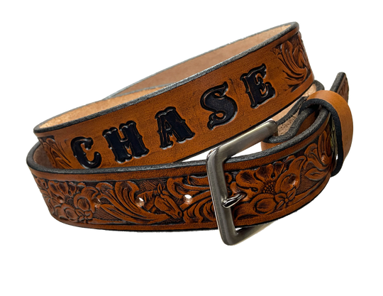 Our "The Mustang" Name Leather belt is Full grain American vegetable tanned cowhide approx. 1/8"thick. Width 1 1/2" and includes Antique Nickle plated Solid Brass buckle Hand Finished in 3 color options Smooth burnished painted edges Choose with or without name, if without name, design will cover entire length of belt For name Type name desired on belt in "Type Name Here" section, no more than 8 letters maximum Buckle snaps in place for easy changing if desired Made in our Smyrna, TN, USA shop