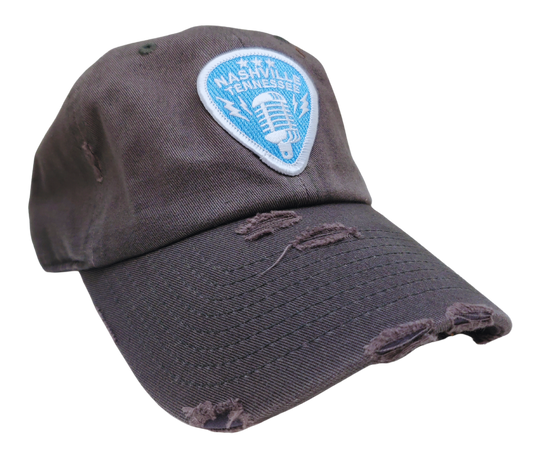 Discover the adventurous spirit of Nashville, the music city of legends! This one-of-a-kind Guitar Pick Cap proudly features the iconic Classic Microphone, symbolizing the birthplace of rock n&