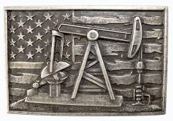 The Pump Jack Buckle by Nocona is rectangle in shape and displays an oil rig pump jack in front of a distressed American flag. Fits a standard 1 1/2" belt. Finished in a dark antique silver color, this buckle, made of zinc and iron, is approximately 2 1/2" by 3 3/4" in size.

Available online and in our shop in Smyrna, TN, just outside of Nashville.