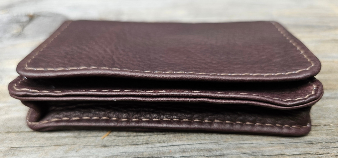 The Notch Card I.D. case in for the Minimalist attitude in a Soft Leather wallet. Fit's easily in your front pocket or bag. Flap-over to gusseted pocket for credit cards and/or business cards. Leather improves with age as it absorbs the oils from your hands and assumes a classic, worn look. Additional open pocket for cards on the back. Now stocked at our Smyrna, TN shop not far from Opry Mills Mall.

Handcrafted in Colombia, South America.
Open pocket. * I.D. window.
Dimensions 4 x 2.75 inches
