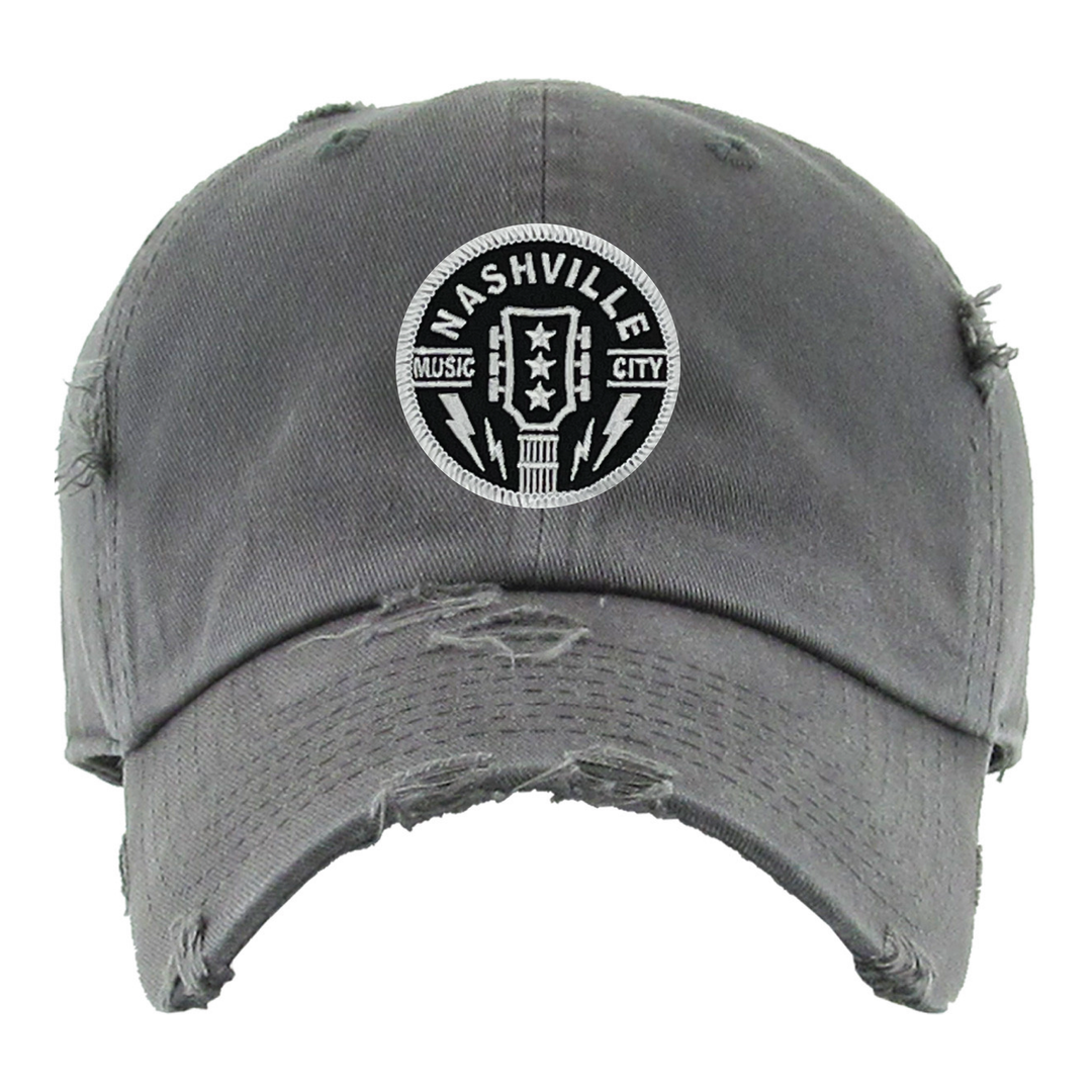 Vintage Style distressed Nashville Music City Guitar Cap. Has the Iconic 3 stars of Tennessee with Guitar Headstock. Pre-curved visor with 8-row stitching on visor with matching under visor 6 panel low profile unconstructed Lightweight, durable, smooth, with a hint of stretch. See these in our Smyrna, TN shop not far from wild Downtown Nashville.

Washed style 100% breathable premium cotton
One size fits most
Unisex design
Adjustable metal buckle back closure