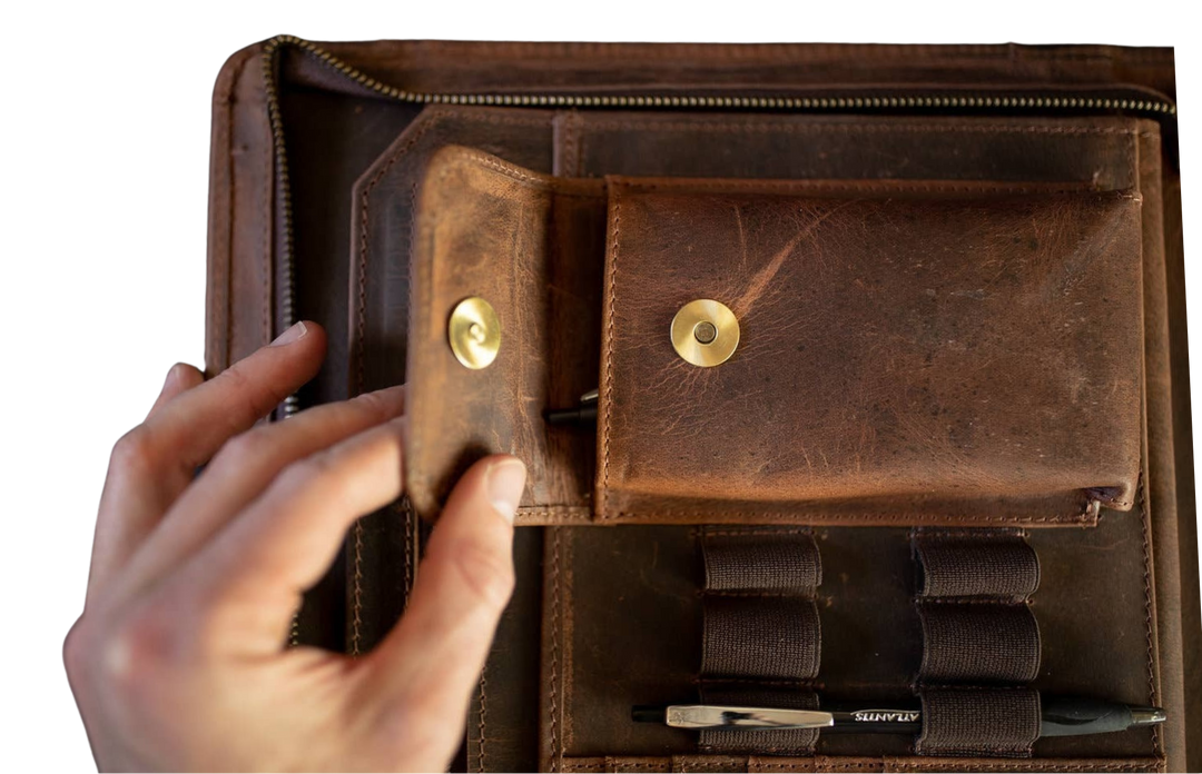 The Nomad Leather Portfolio is the perfect blend of rugged durability and professional style, designed to keep you organized wherever work takes you. Crafted from top-grain water buffalo leather, dedicated sleeve for a tablet, documents, and a letter size pad or planner insert. Whether you’re in the office, traveling, or working remotely, the Nomad Portfolio ensures you stay prepared in timeless leather craftsmanship. See them at our Smyrna, TN shop.
