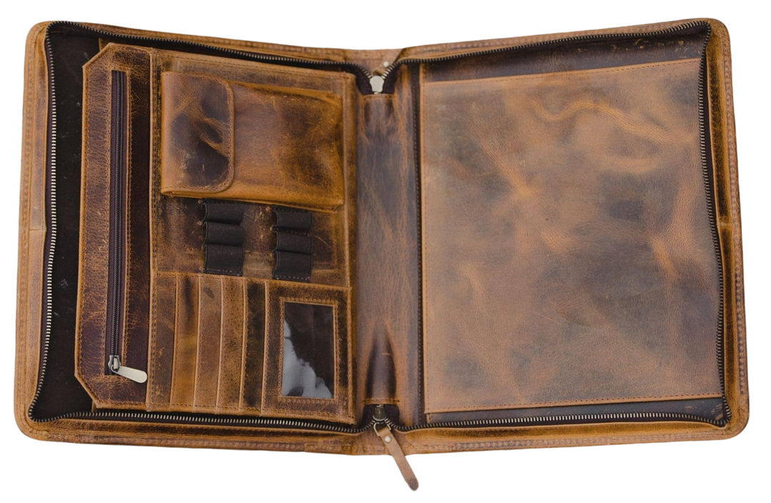 The Nomad Leather Portfolio is the perfect blend of rugged durability and professional style, designed to keep you organized wherever work takes you. Crafted from top-grain water buffalo leather, dedicated sleeve for a tablet, documents, and a letter size pad or planner insert. Whether you’re in the office, traveling, or working remotely, the Nomad Portfolio ensures you stay prepared in timeless leather craftsmanship. See them at our Smyrna, TN shop.