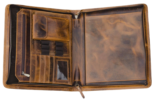 The Nomad Leather Portfolio is the perfect blend of rugged durability and professional style, designed to keep you organized wherever work takes you. Crafted from top-grain water buffalo leather, dedicated sleeve for a tablet, documents, and a letter size pad or planner insert. Whether you’re in the office, traveling, or working remotely, the Nomad Portfolio ensures you stay prepared in timeless leather craftsmanship. See them at our Smyrna, TN shop.