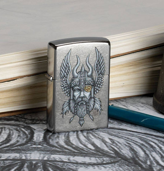 This Nordic Viking is a digitally-transferred color image on a Street Chrome™ lighter. All metal construction; windproof design works virtually anywhere. Refillable for a lifetime of use. Comes packaged in a gift box. Available in our Smyrna, TN shop.

Made in USA
Fuel: Zippo lighter fuel (sold separately)
Lighter Specs: Height: 2.25" Width: 0.5" Depth: 1.5" Weight: 2.0 oz
Lifetime guarantee that "it works or we fix it free™" Zippo contact info on gift box.