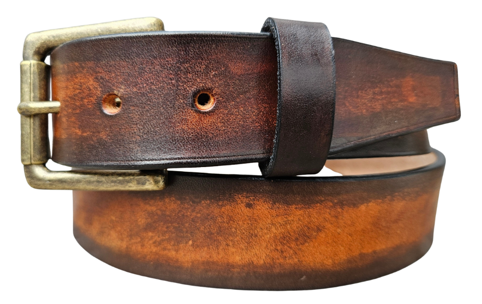This real Veg-Tan leather belt starts with a hand dyed and finished 9-10oz (1/8"ish) leather belt strip. Great for the casual days at the Office or running round town. Comes in a 1 1/2" width and your choice of Antique Nickle or Brass colored buckle that is attached by screw post for easy removal. It is handmade in our Smyrna, TN shop, which is located just outside of Nashville.