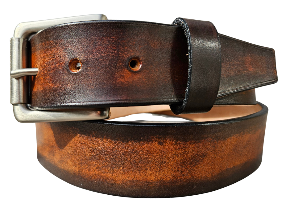 This real Veg-Tan leather belt starts with a hand dyed and finished 9-10oz (1/8"ish) leather belt strip. Great for the casual days at the Office or running round town. Comes in a 1 1/2" width and your choice of Antique Nickle or Brass colored buckle that is attached by screw post for easy removal. It is handmade in our Smyrna, TN shop, which is located just outside of Nashville.
