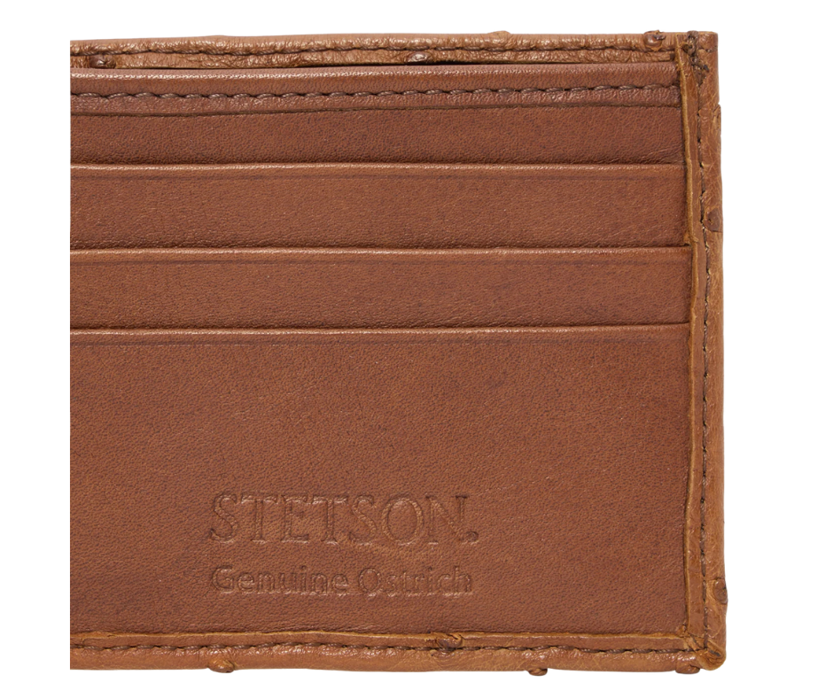 Made from authentic Cognac Ostrich leather, this bi-fold wallet blends classic western flair with bold luxury. True to Stetson’s legendary craftsmanship, it offers 6 card slots, 2 hidden pockets, and a spacious leather-lined cash compartment. Ready for you at our Smyrna, TN store, just a short drive from Nashville. Proudly made in Mexico.