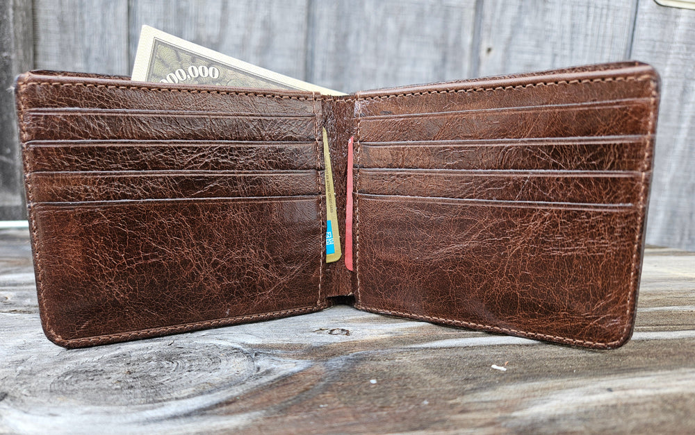 If you appreciate craftmanship this USA Made Genuine Ostrich Leg Genuine Bifold will do the trick. Inside is complete with matching Leather Lining, 1 Bill Pocket, 8 Card Slots, 2 Inner Side Pockets. Each hide is unique, each wallet is unique! Handmade in USA and sold in our Smyrna, TN shop not far from the gulch downtown Nashville.