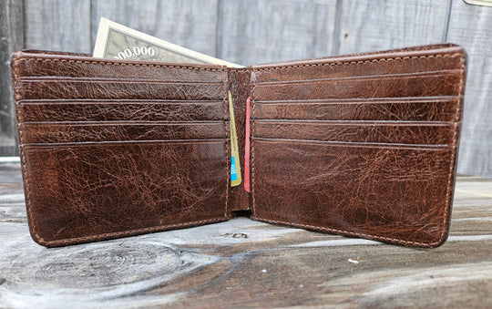 If you appreciate craftmanship this USA Made Genuine Ostrich Leg Genuine Bifold will do the trick. Inside is complete with matching Leather Lining, 1 Bill Pocket, 8 Card Slots, 2 Inner Side Pockets. Each hide is unique, each wallet is unique! Handmade in USA and sold in our Smyrna, TN shop not far from the gulch downtown Nashville.