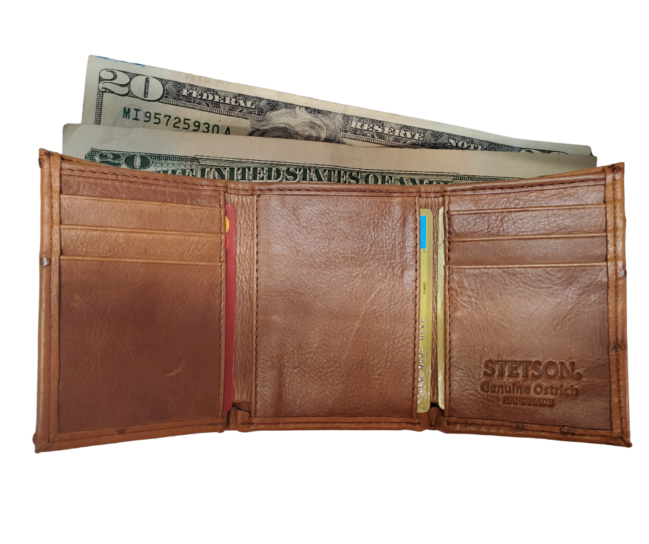 Made from authentic Cognac Ostrich leather, this bi-fold wallet blends classic western flair with luxurious materials that turn heads. The Stetson name guarantees top-notch craftsmanship and meticulous detail. It offers 6 card slots, 3 hidden pockets underneath, and a spacious leather-lined cash compartment. Available now at our Smyrna, TN store, just a short drive from downtown Nashville. Proudly made in Mexico.