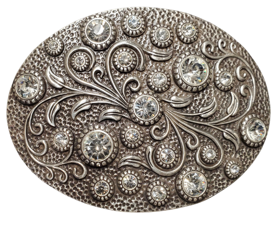 Need a splash of sparkle? The Bling Flower Spray Belt Buckle is your fashion BFF! With dazzling round rhinestones dancing on an antique silver canvas, this accessory transforms basic jeans-and-tee combos or adds extra pop to most any style. Swing by our Smyrna, TN shop before they're gone! Perfectly sized for 1½" belts. Approximately 4.25 x 3 inches.