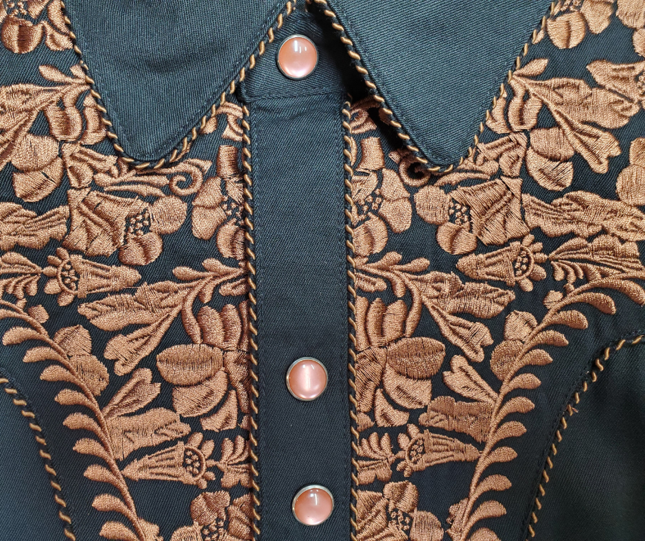 Close up - Western shirts with Embroidered Western Tooled stitching never go out of style! Inspired by classic cowboy movies, these timeless designs are favorites of today’s country stars and rock icons alike. Pair them with your favorite ripped jeans for a casual vibe or dress them up with sharp jeans for a night out. Just arrived at our Smyrna, TN shop, just a stone’s throw from Music Row in downtown Nashville!