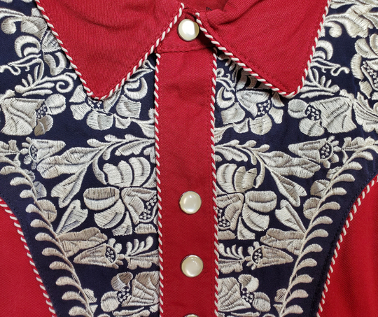 Close up - Western shirts with Embroidered Western Tooled stitching never go out of style! Inspired by classic cowboy movies, these timeless designs are favorites of today’s country stars and rock icons alike. Pair them with your favorite ripped jeans for a casual vibe or dress them up with sharp jeans for a night out. Just arrived at our Smyrna, TN shop, just a stone’s throw from Music Row in downtown Nashville!